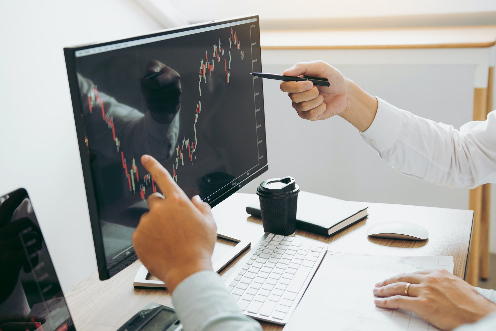business stock brokers stress and looking at monitors displaying financial stock graph